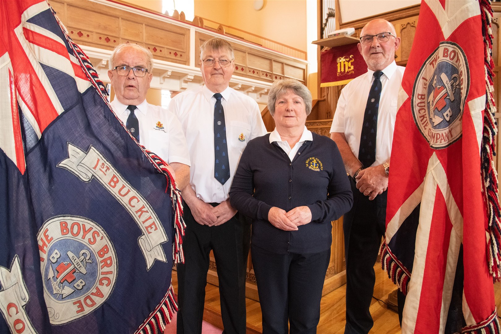 1st Buckie Company Boys' Brigade Captain Alan McIntosh (second left) is joined by fellow officers Gordon Pirie (left), Jennifer McIntosh and Grant Stewart in celebrating the group's Queen's Award for Voluntary Service. Picture: Daniel Forsyth