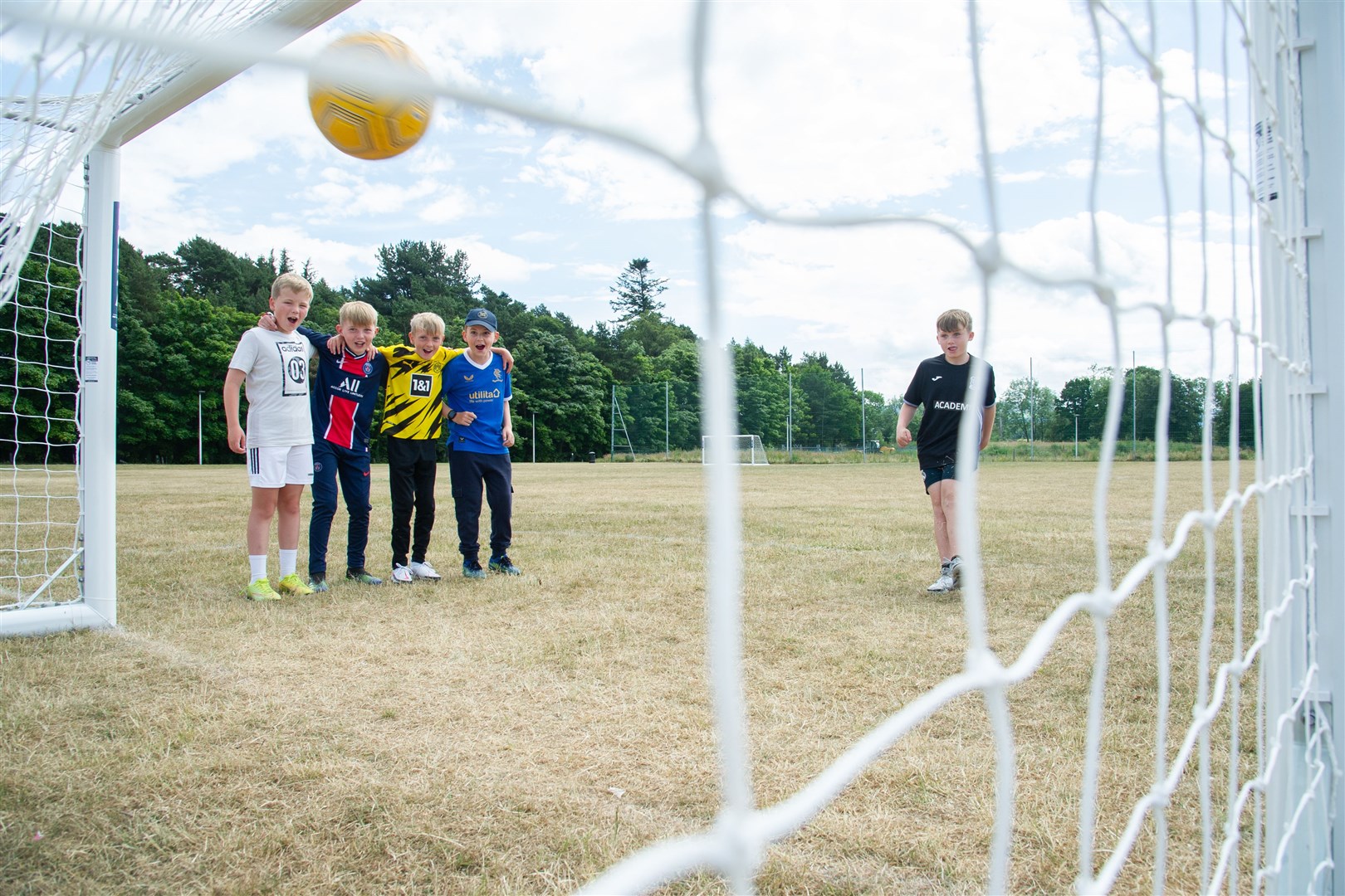 Jayden Stephen takes a shot at goal watched on by Mackie Stewart, Mitchell Grant, Louie Buchan and Tyler McCabe...New football goals have been put up at Thornhill Playing Field in New Elgin after a fundraising campaign raised Â£4,000 for the cause. ..Picture: Daniel Forsyth..