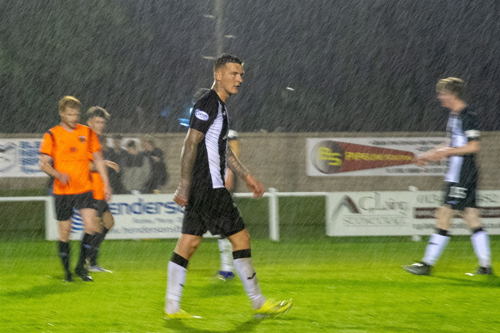 Not a good night in the rain for Elgin City's Darryl McHardy against his former Rothes team-mates. Picture: Daniel Forsyth....