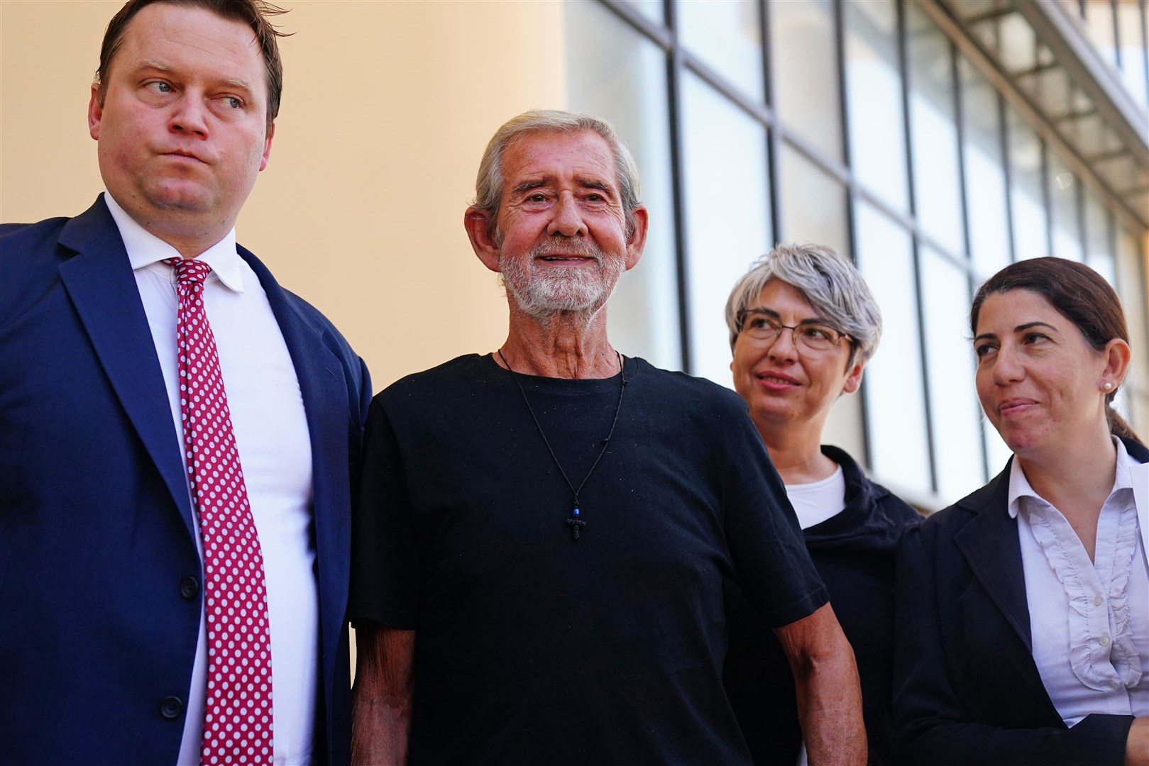 David Hunter with his defence team and Michael Polak, the director of Justice Abroad, outside Paphos District Court in Cyprus after he was released from custody (Victoria Jones/PA)
