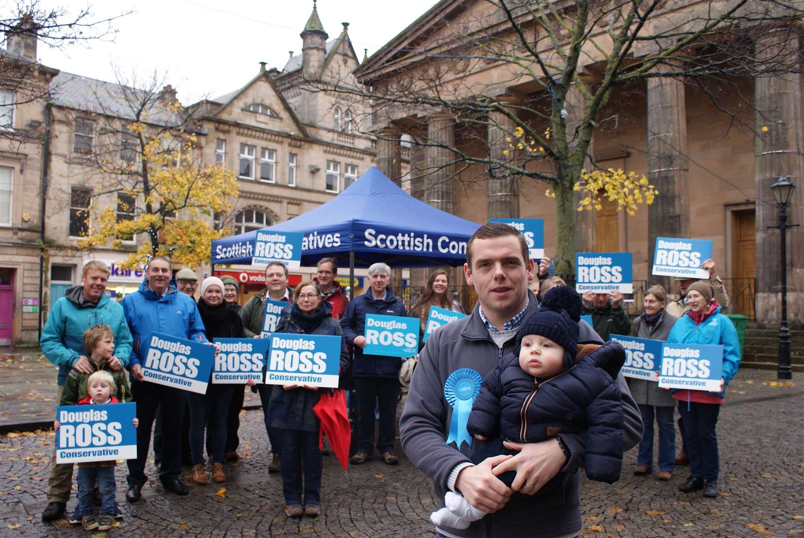 Douglas Ross with his son Alistair and Conservative supporters.