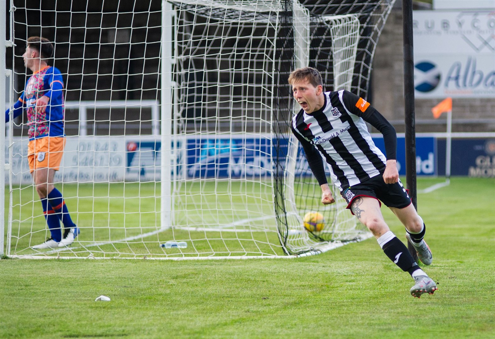 Kane Hester makes no mistake as he taps home after Brian Cameron's effort came off the bar. ..Elgin City FC (3) vs Queen's Park FC (2) - Scottish League Two - Borough Briggs, Elgin 04/05/2021...Picture: Daniel Forsyth..