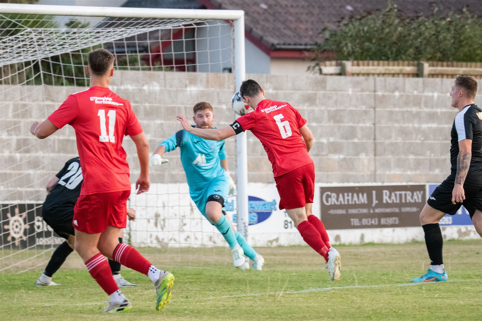 Lossiemouth captain Liam Archibald (#6) heads home the opener for the home side. ..Lossiemouth FC (4) vs Strathspey Thistle (2) - Highland Football League 22/23 - Grant Park, Lossiemouth 24/08/2022...Picture: Daniel Forsyth..