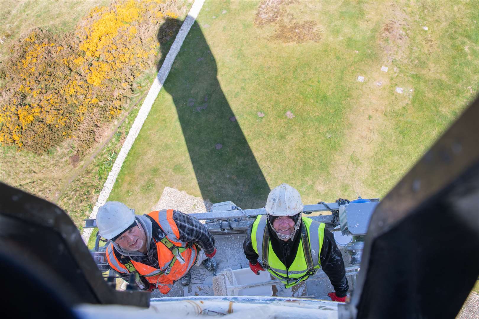 Darren Marshall (left) and Stevie Martin (right) on the platform suspended on the lighthouse tower. Picture: Daniel Forsyth
