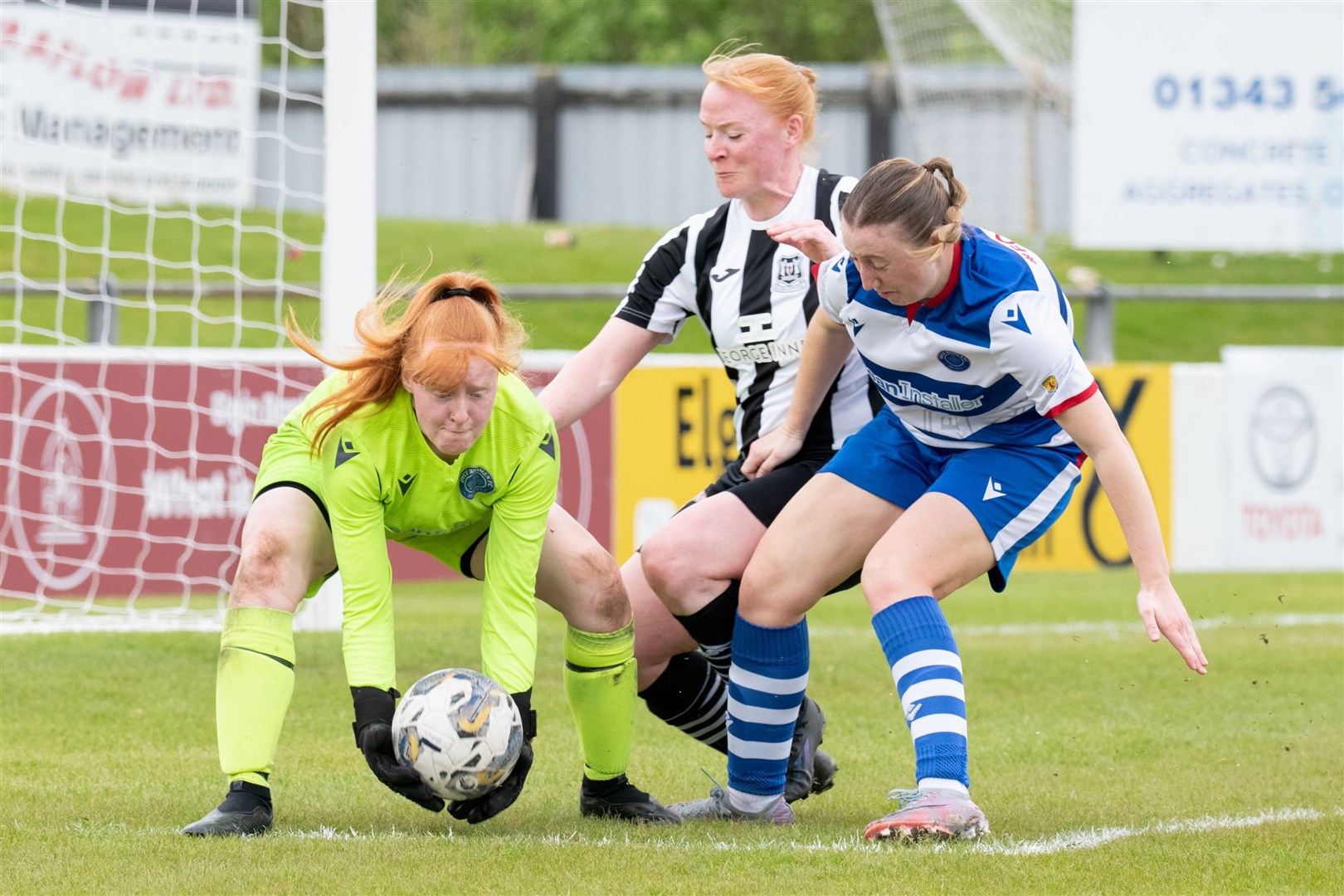 Dyce keeper Faith Jessica Maan is first to the ball ahead of Elgin City's Josie Mitchell and Dyce's Abbie Milne.Elgin City Women (5) vs Dyce Women FC (5) - SWFL North 2023/24 - Borough Briggs, Elgin 5/5/2024.Picture: Daniel Forsyth.