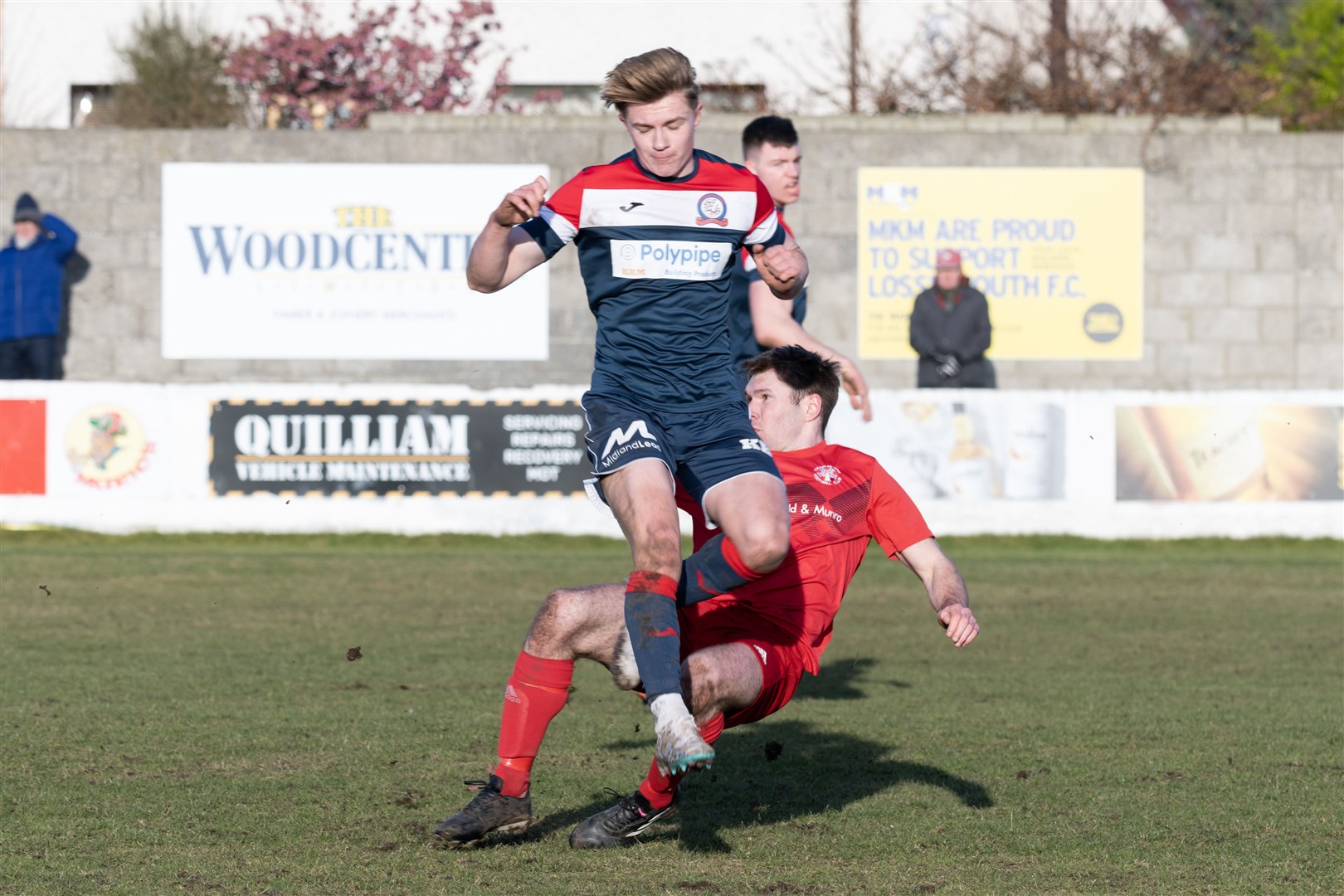 Lossie's Ross Paterson making a successful tackle against Turriff's Jack McKenzie. ..Lossiemouth F.C. v Turriff United F.C. at Grant Park...Picture: Beth Taylor.