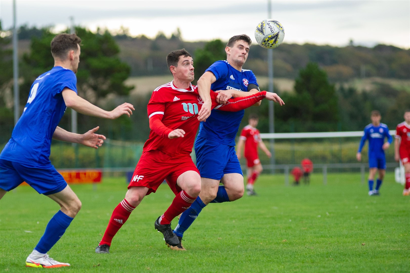 Vale's Ben Allan and Lossie's Liam Archibald tussle for the ball...Deveronvale FC (6) vs Lossiemouth FC (0) - Highland Football League - Princess Royal Park, Banff 23/10/2021...Picture: Daniel Forsyth..