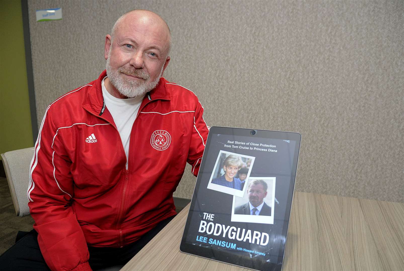 Elgin martial arts trainer and close protection expert Lee Sansum with his memoir, The Bodyguard. Picture: Becky Saunderson.