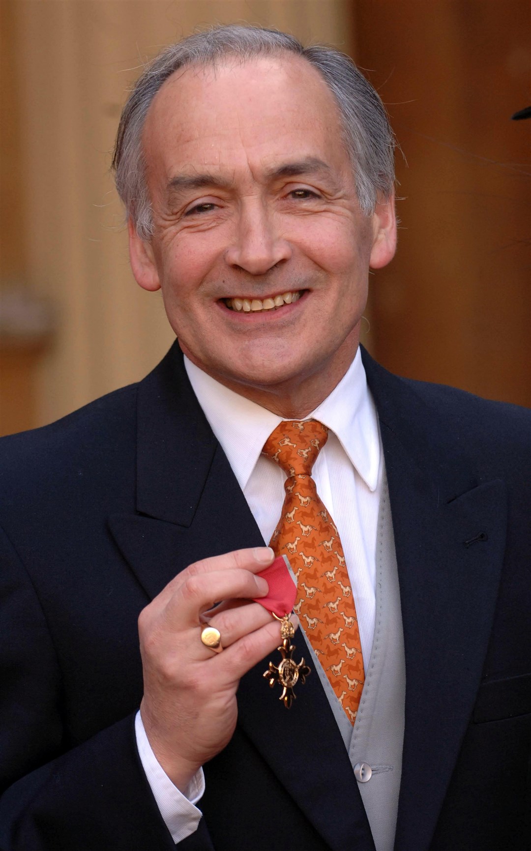Alastair Stewart was made an OBE for services to broadcasting and charity in 2006 (Stefan Rousseau/PA)