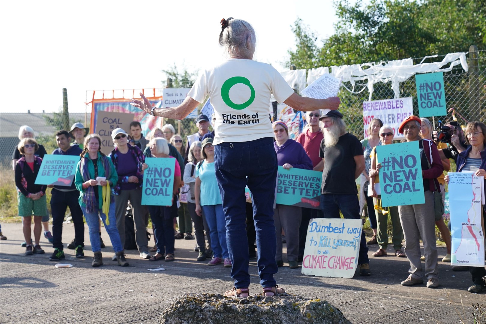 Demonstrators outside the site of a proposed coal mine in West Cumbria (Owen Humphreys/ PA)