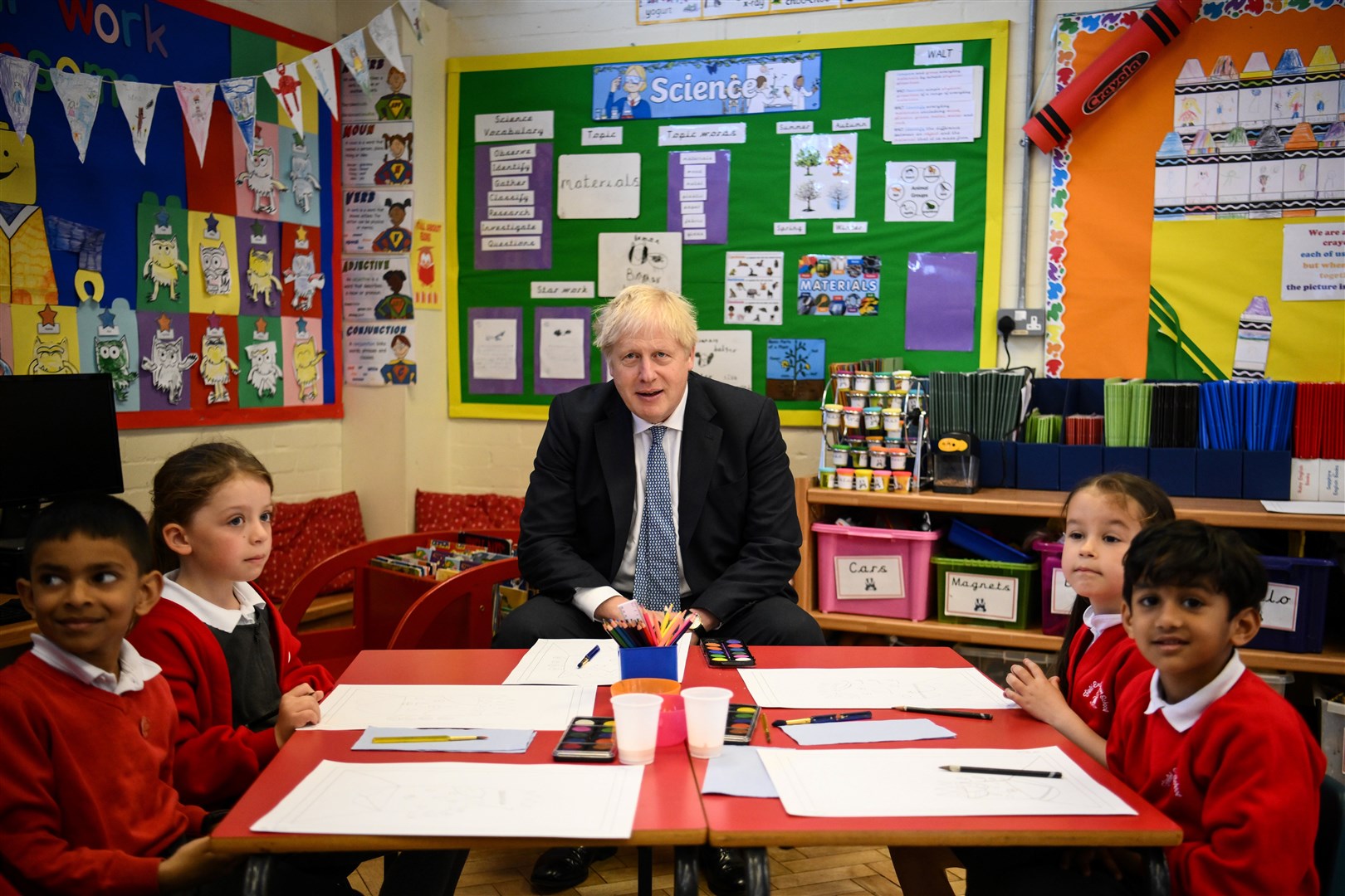 Prime Minister Boris Johnson paints with children at Field End Infant School in South Ruislip (Daniel Leal/PA)