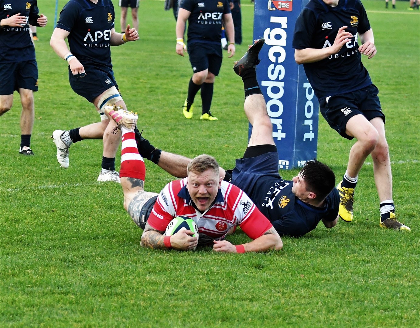 Lewis Scott is delighted as he goes over the line to score the winning try. Picture: James Officer