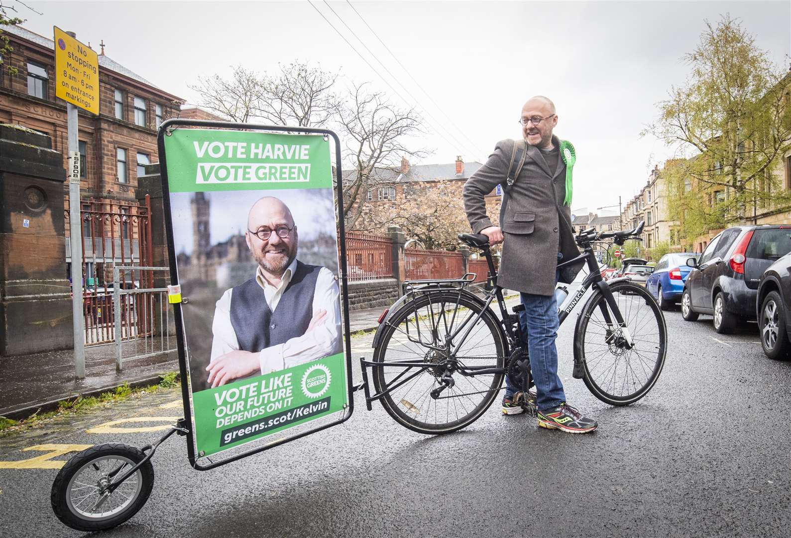 Scottish Greens co-leader Patrick Harvie pulled a billboard featuring his own face as he left his polling station in Glasgow’s west end (Jane Barlow/PA)