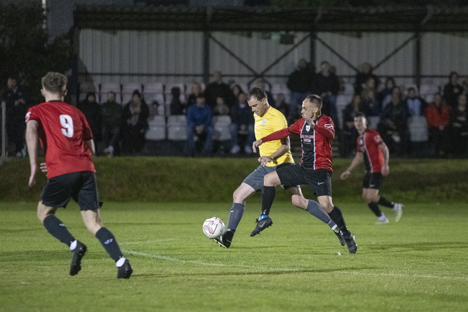 Gary Burchell battles to win the ball back in midfield for FC Fochabers. Picture: Becky Saunderson