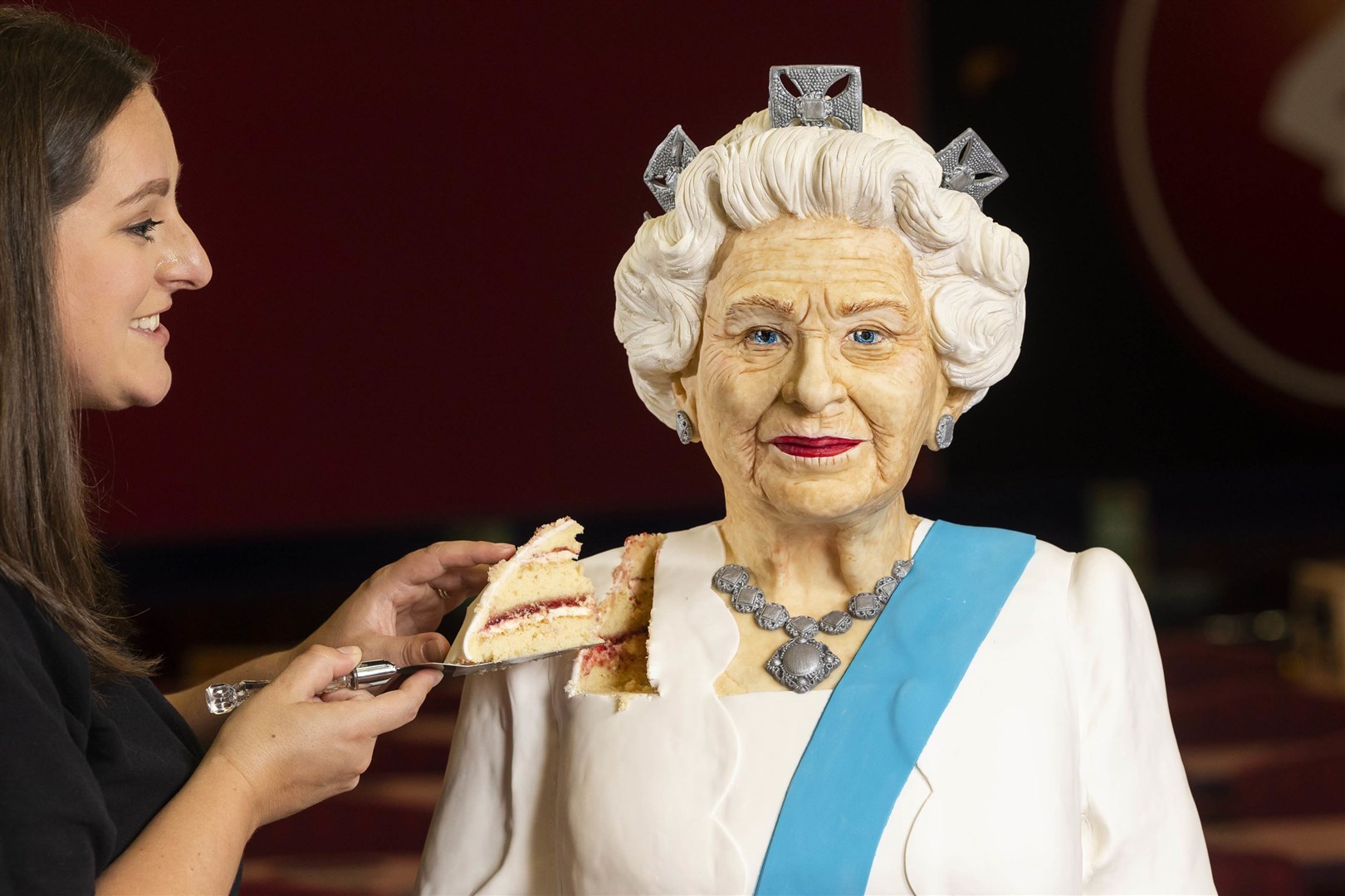 Baker Lara Mason of Cake Anything unveils a life-sized cake of Queen Elizabeth II, (Fabio De Paola/PA)