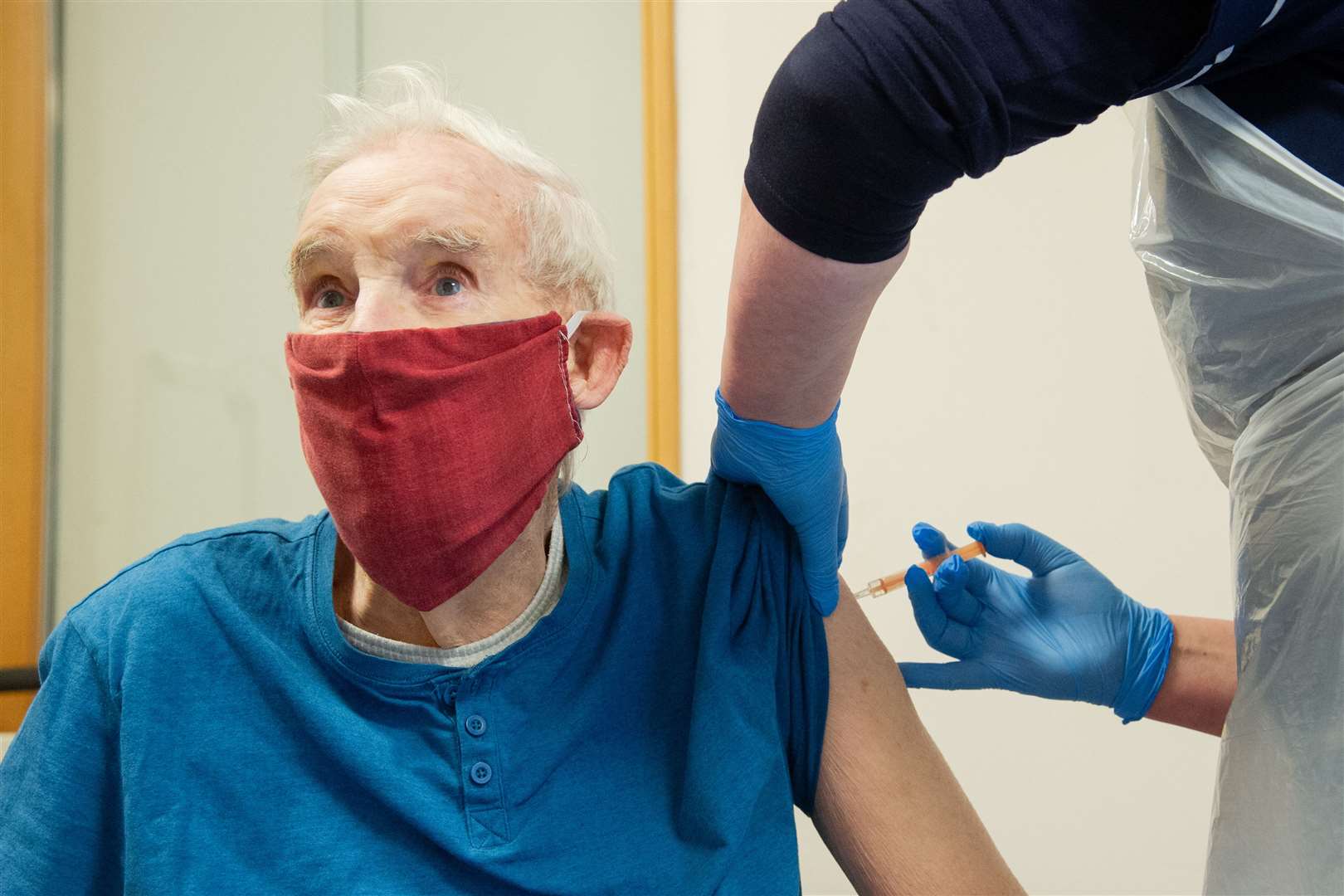 Donnie Stewart (89) gets his first dose from practice nurse Susan McSheffrey. Picture: Daniel Forsyth