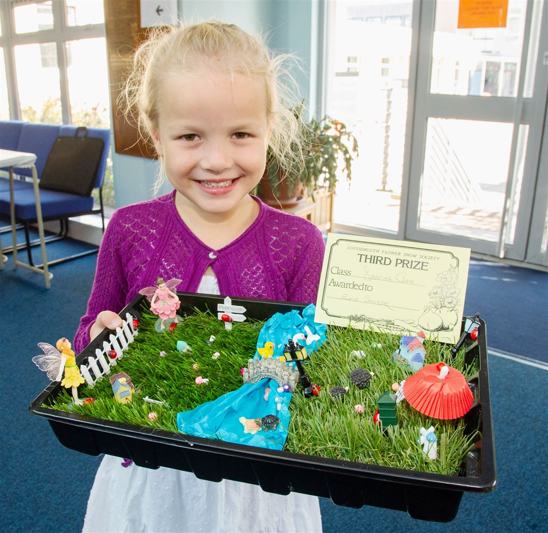 Evie Souter with her miniature garden. Picture: Daniel Forsyth