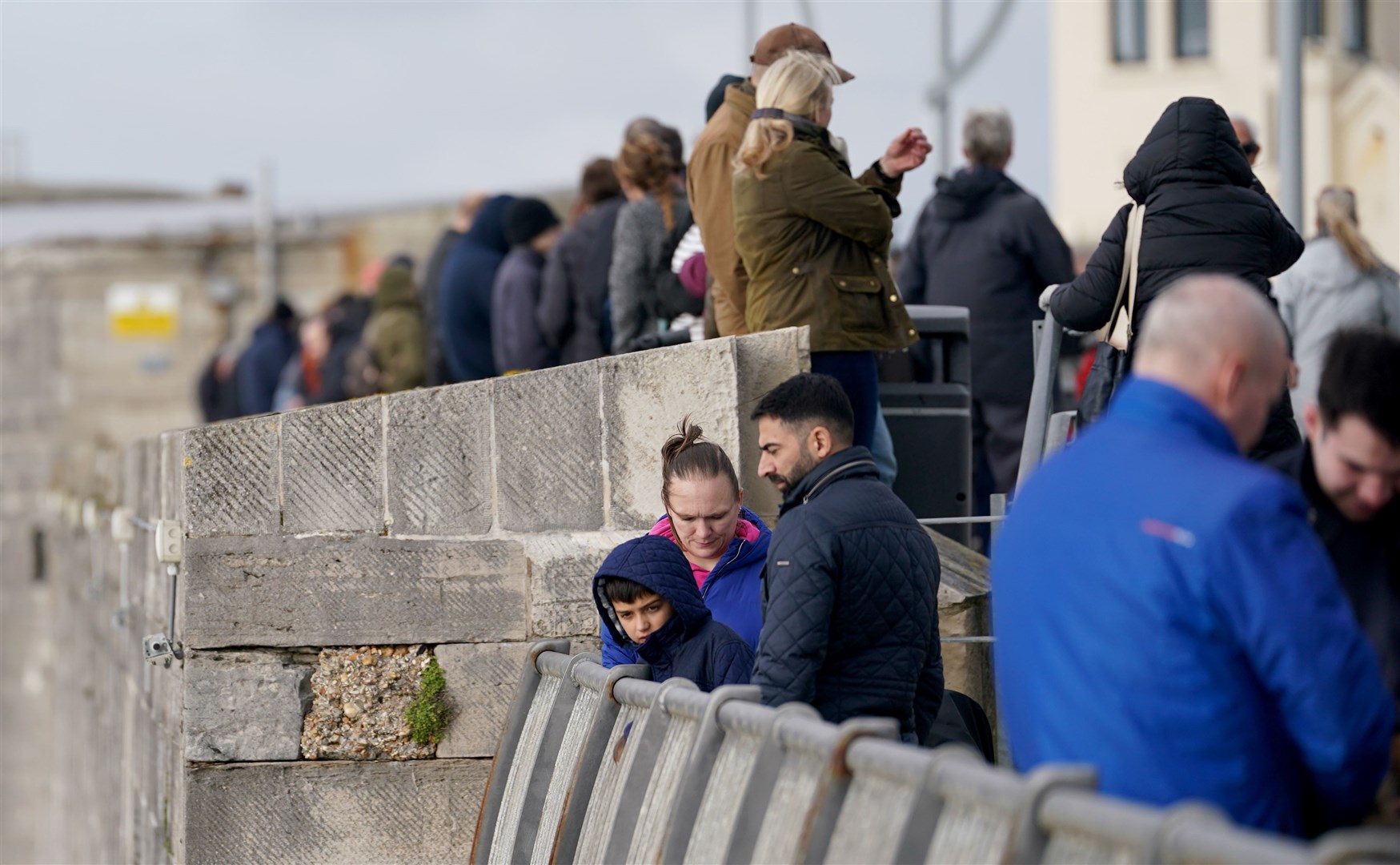 Spectators near Portsmouth Harbour hoped to see the Royal Navy aircraft carrier HMS Prince of Wales off (Gareth Fuller/PA)