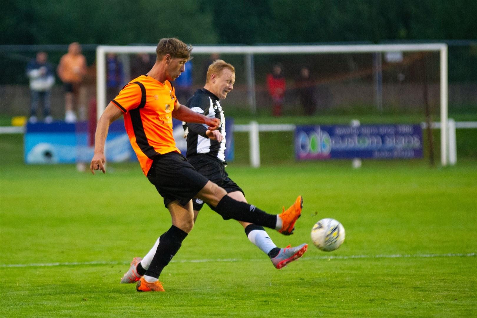 Rothes' Ally Mackenzie and Elgin City's Russell Dingwall clash for the ball. Picture: Daniel Forsyth....