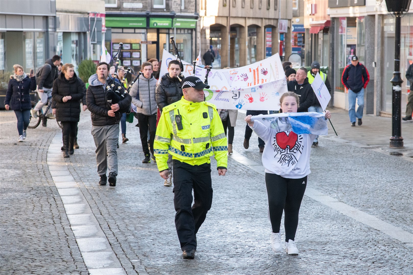 They marched from the Council HQ, around the Plainstones and then back to the HQ...Moray Council celebrate Care day - a national day of recognising and celebrating care experience. ..Picture: Daniel Forsyth..