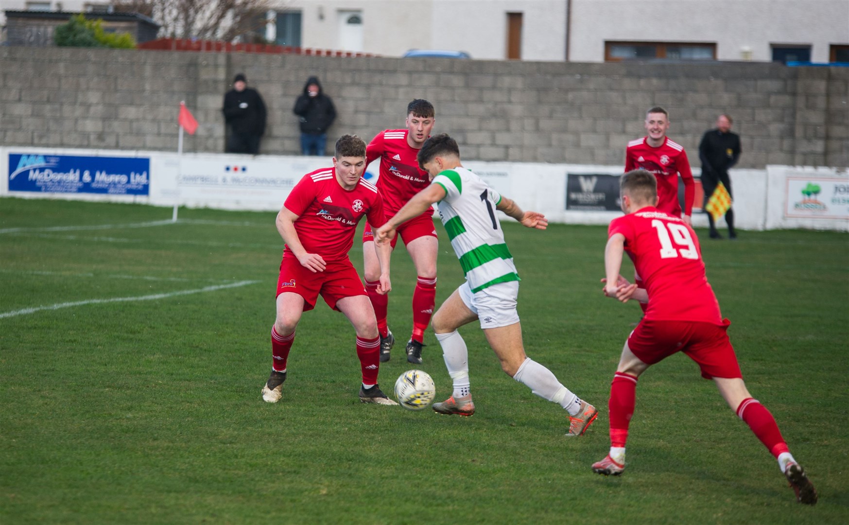 Fergus Edwards on defensive duty for Lossie against Buckie this season. Picture: Becky Saunderson..