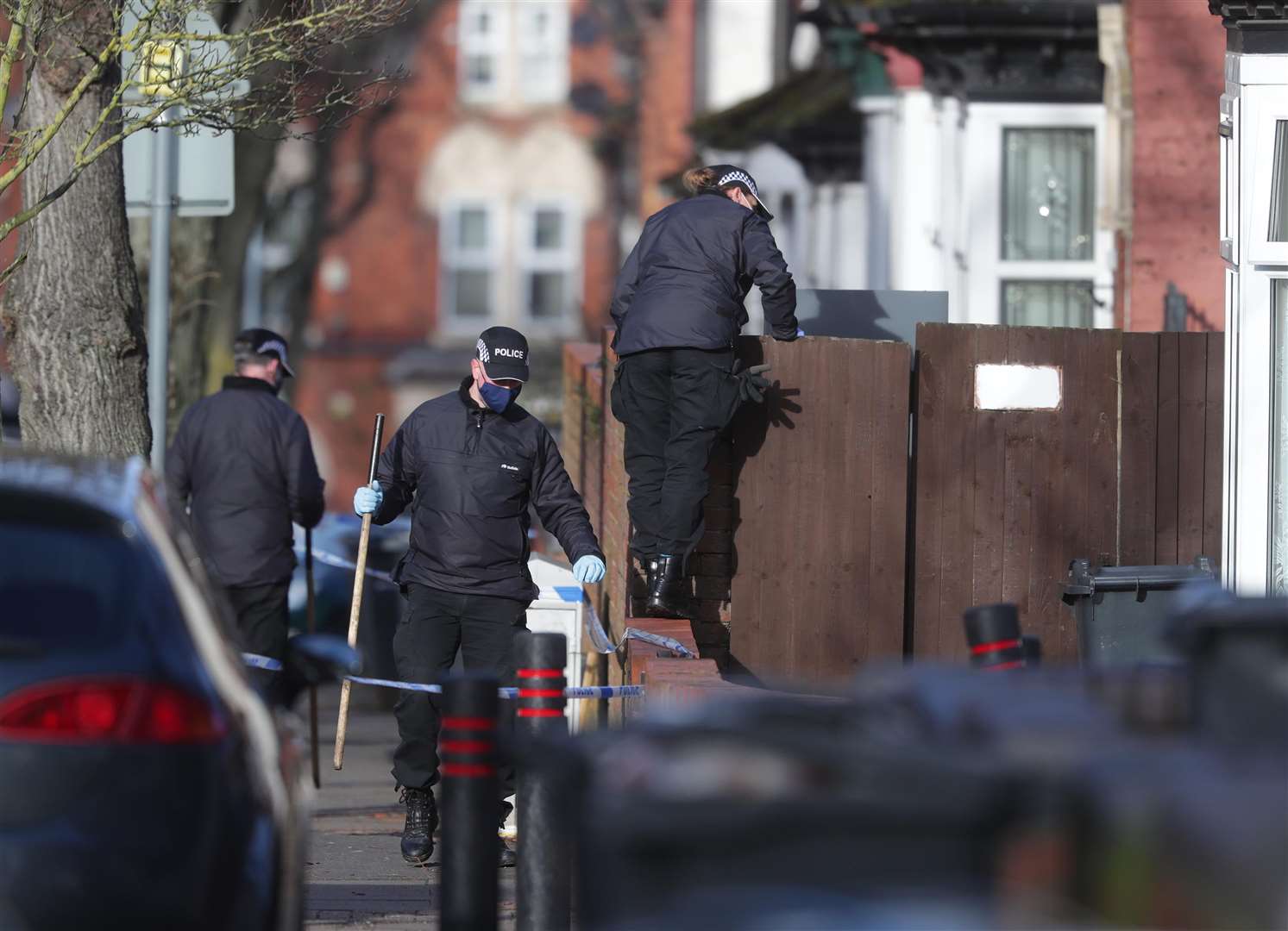 Police officers searching the scene in Linwood Road, Handsworth, where Keon was fatally injured (David Davies/PA)