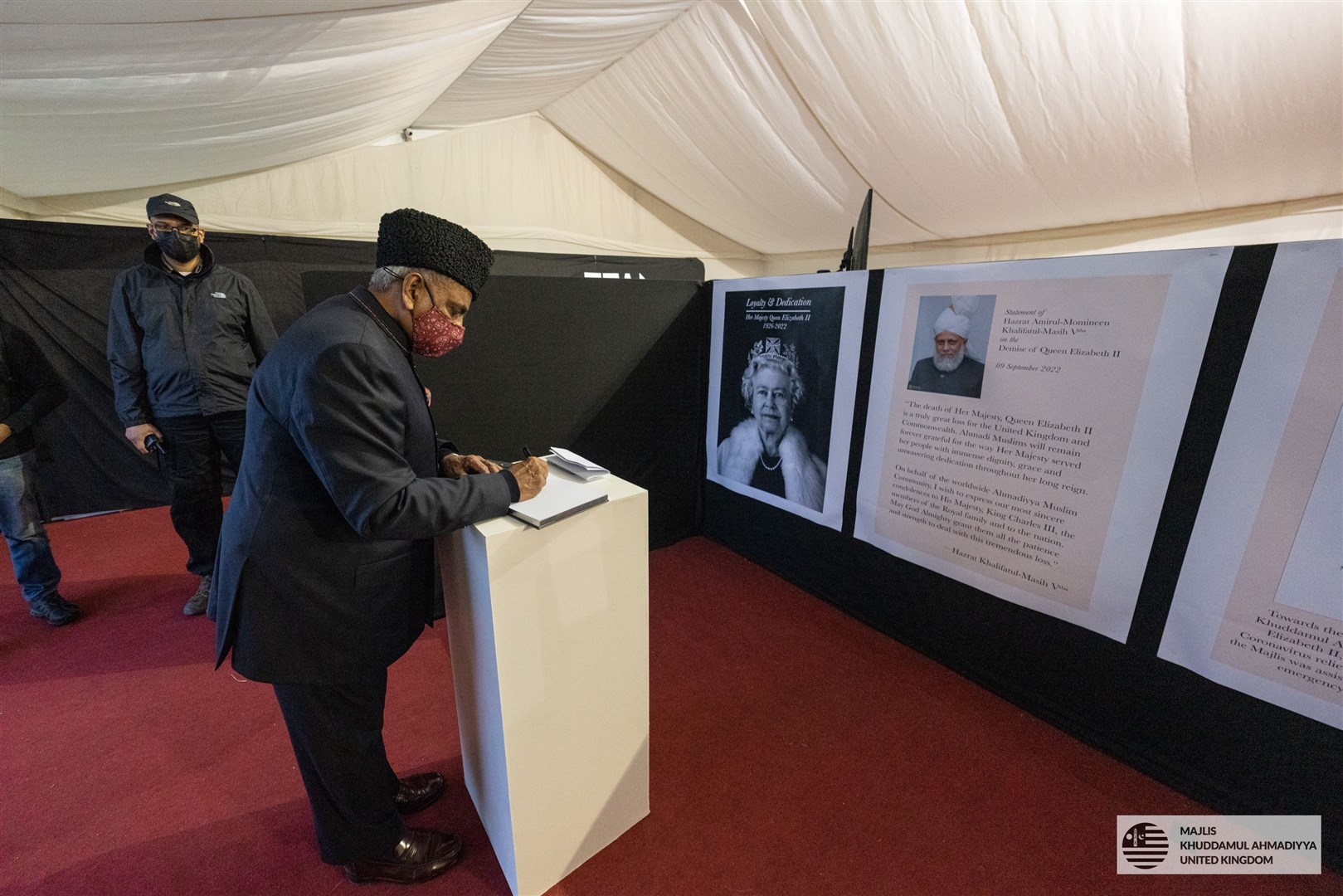 A Muslim man signs the book of condolence (Ahmadiyya Muslim Youth Association UK/PA)