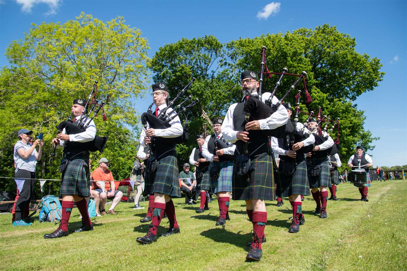 The Portsoy Pipe Band make their way around the playground...Cornhill Highland Games - Saturday 4th June 2022...Picture: Daniel Forsyth..