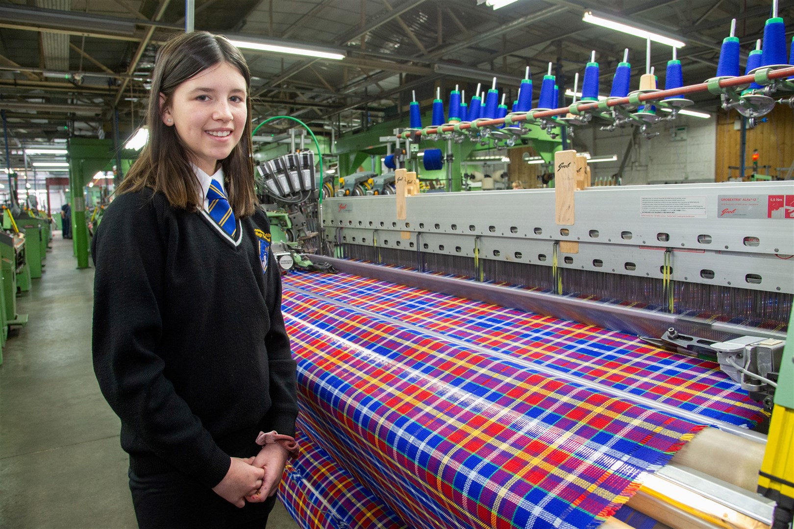 Lossiemouth High School pupil Emma McCann visits Johnstons of Elgin to see her tartan coming off the looms. Picture: Daniel Forsyth.