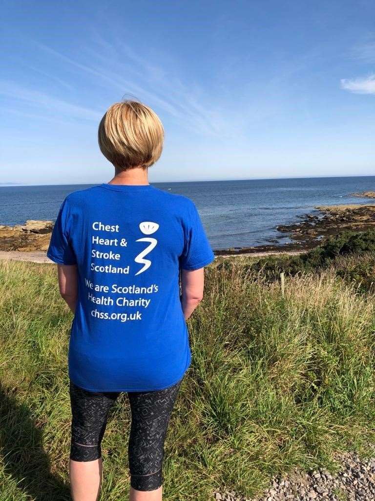 A Virtual Glenlivet 10k runner pauses to look out on the Moray coast.