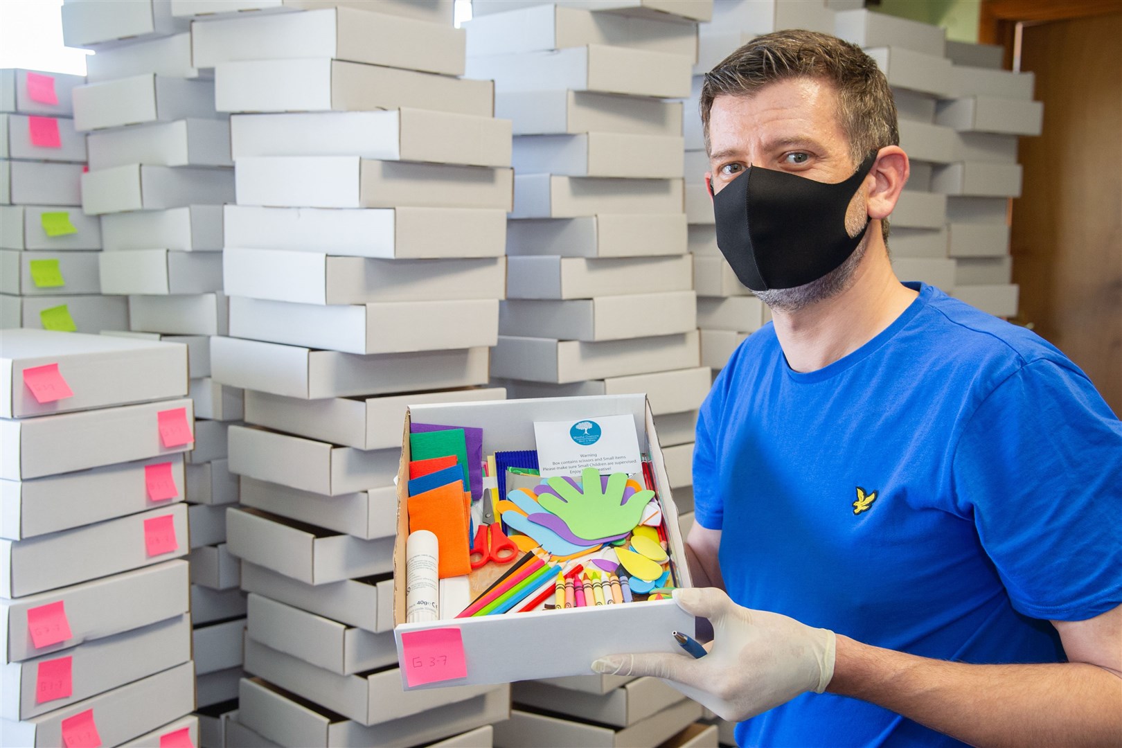 Chris Andrews, director at Mindful Creations CIC, packs up art materials at the group's Cummingston base. Picture: Daniel Forsyth.