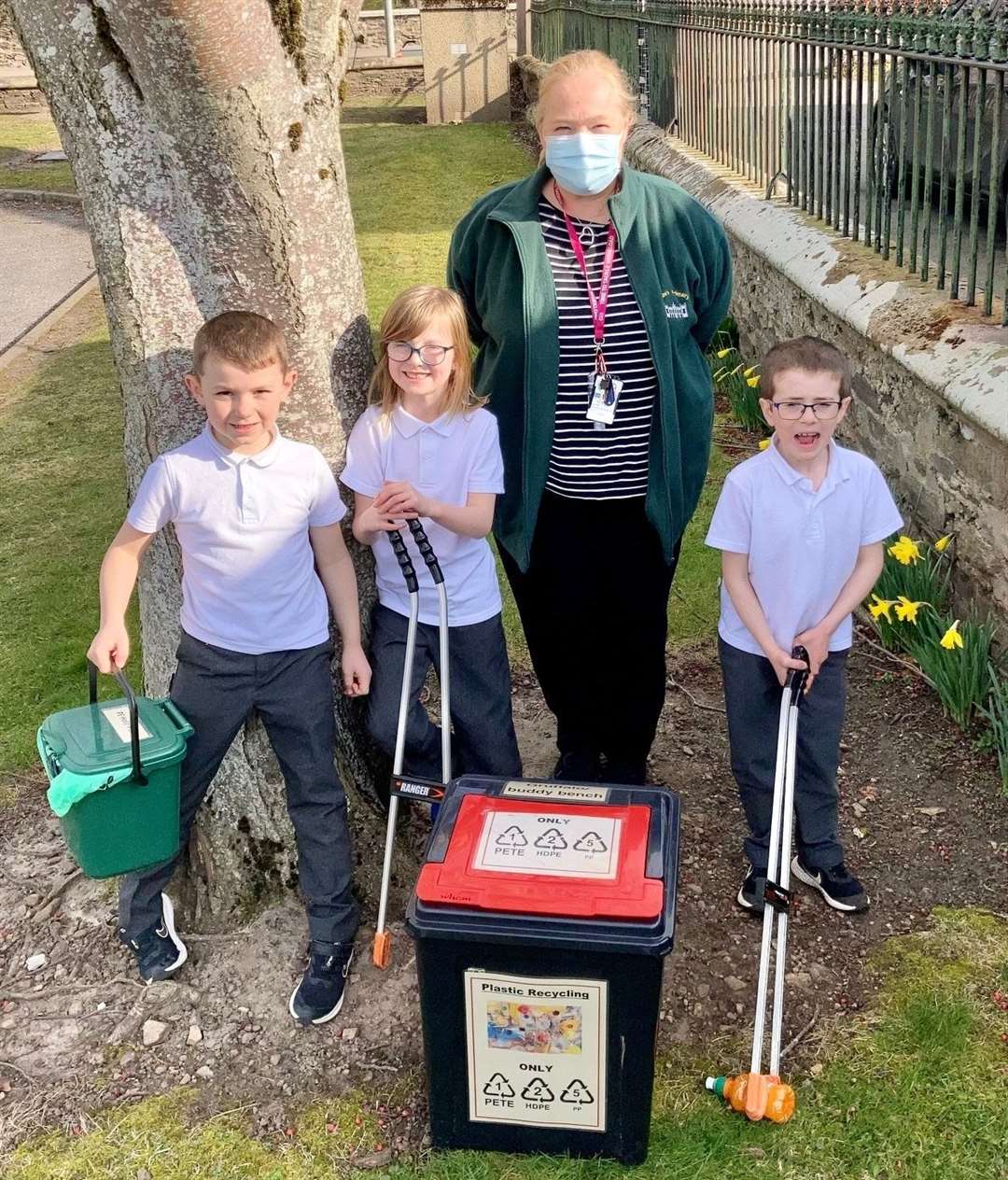 Getting ready to do a spot of award-winning litter picking are (from left) Lewis, Amber, Milne's Primary eco lead Pip Wheeler and John. Picture: Milne's Primary