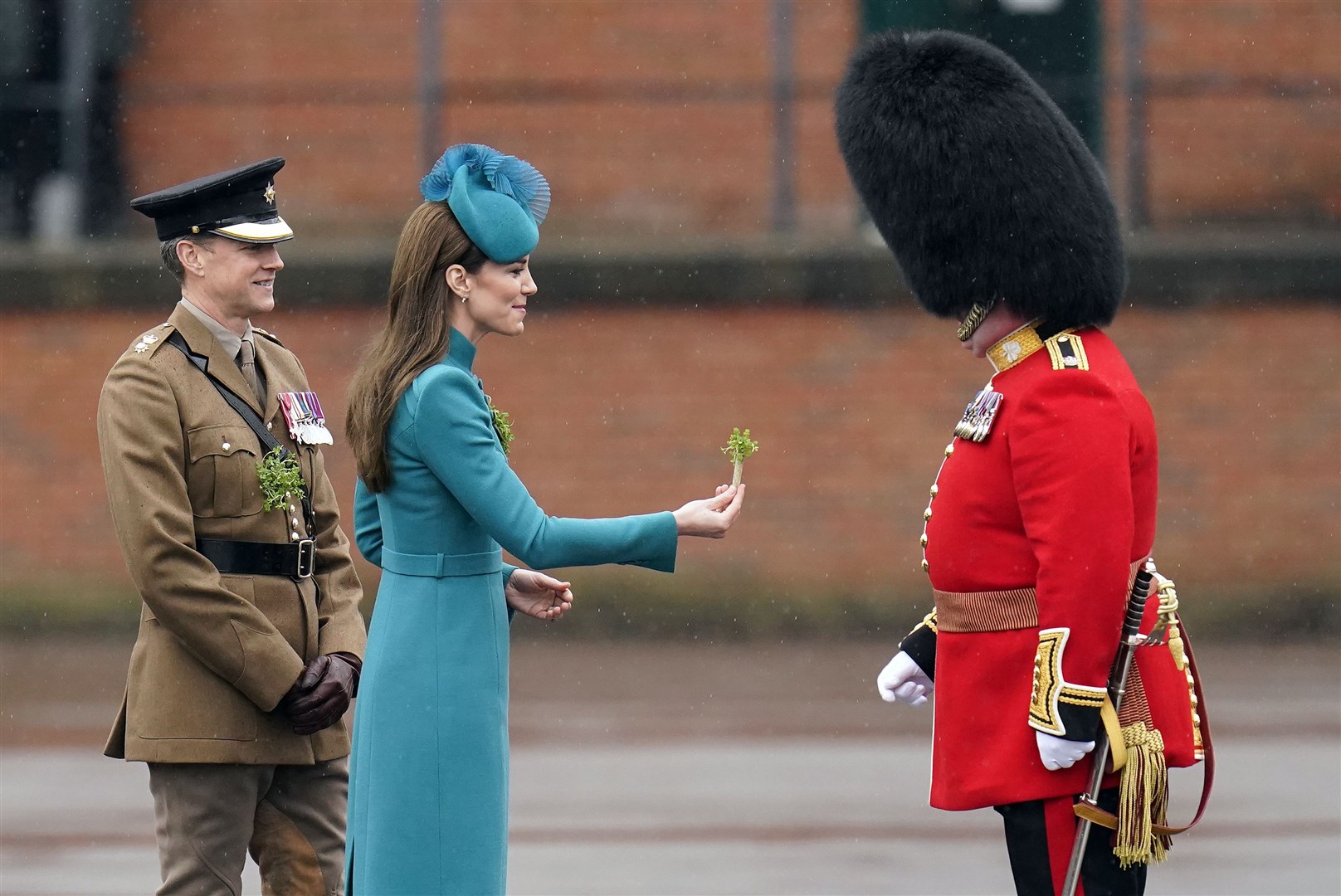 The Princess of Wales presents the traditional sprigs of shamrock to officers and guardsmen of the 1st Battalion Irish Guards for the St Patrick’s Day Parade, at Mons Barracks in Aldershot in 2023 (PA)