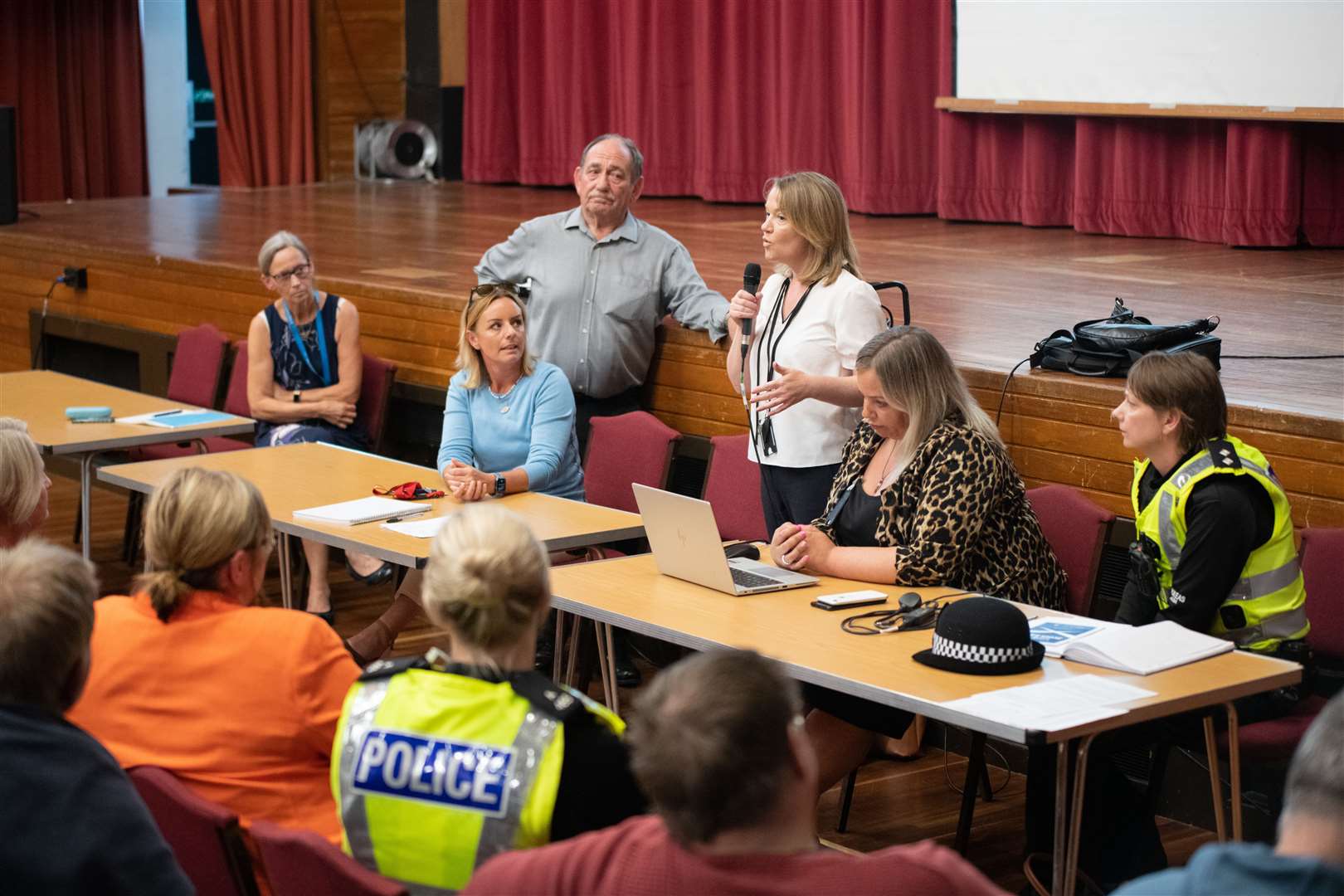 Karen Birse, the council's refugee and resettlement officer, addressed the audience, flanked by representatives form the NHS, the police and Elgin Community Council. All photos: Daniel Forsyth