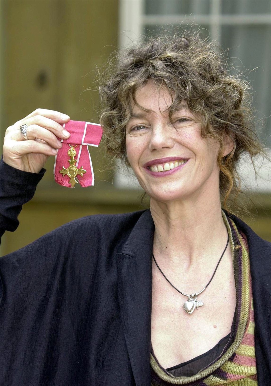 Actress Jane Birkin with her OBE in April 2022 (John Stillwell/PA)