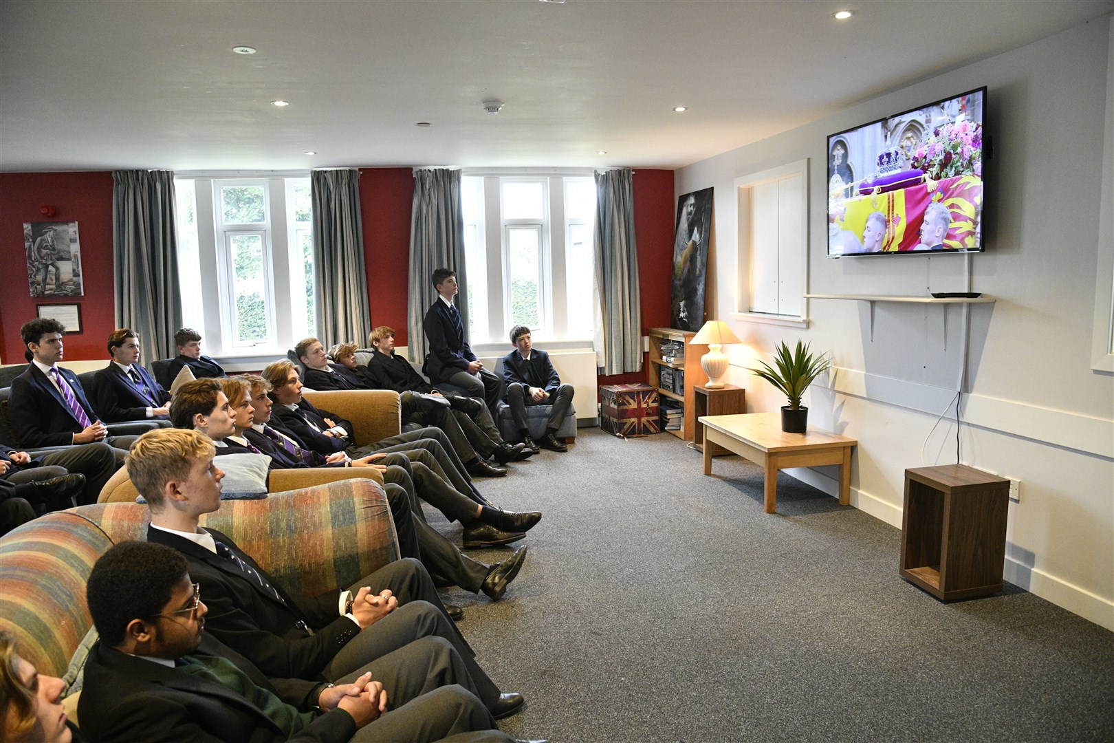 Pupils gathered in their boarding houses to watch the funeral of Queen Elizabeth II. Picture: Daniel Forsyth