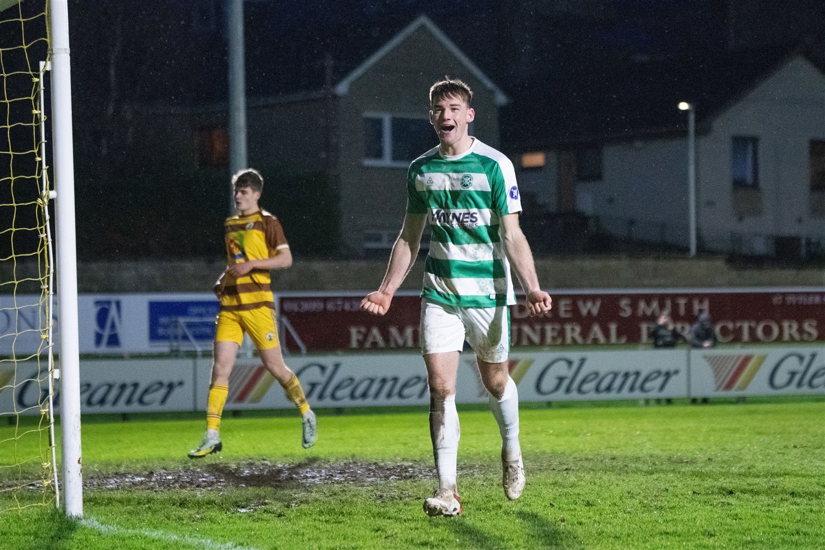 Buckie centre back Jack Murray celebrates after he slots home the first of his two penalties of the afternoon...Forres Mechanics FC (1) vs Buckie Thistle FC (8) - Highland Football League 23/24 - Mosset Park, Forres 30/12/2023...Picture: Daniel Forsyth..