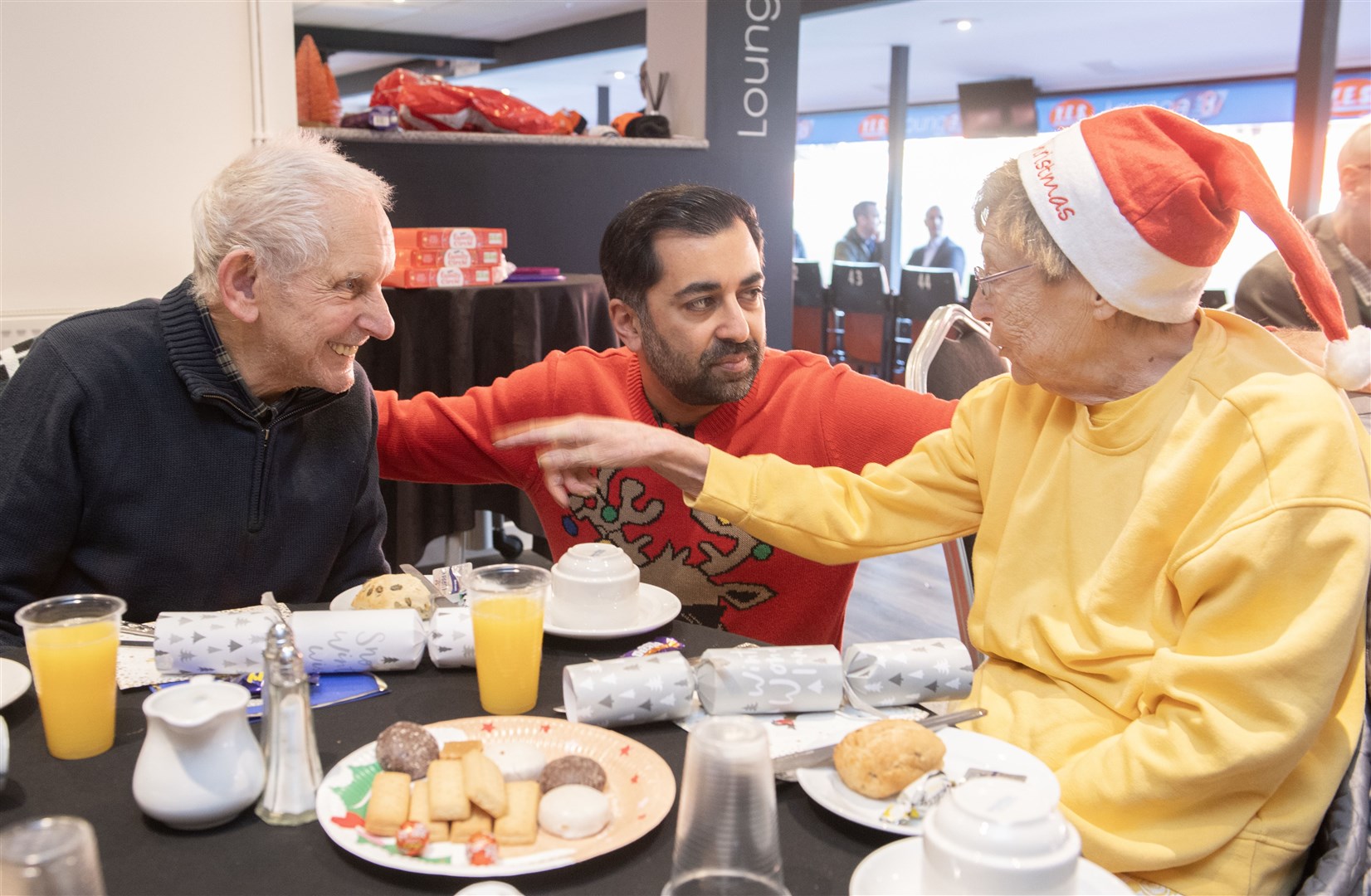 First Minister of Scotland Humza Yousaf as he serves lunch to older people who are at risk of isolation and loneliness (Lesley Martin/PA)