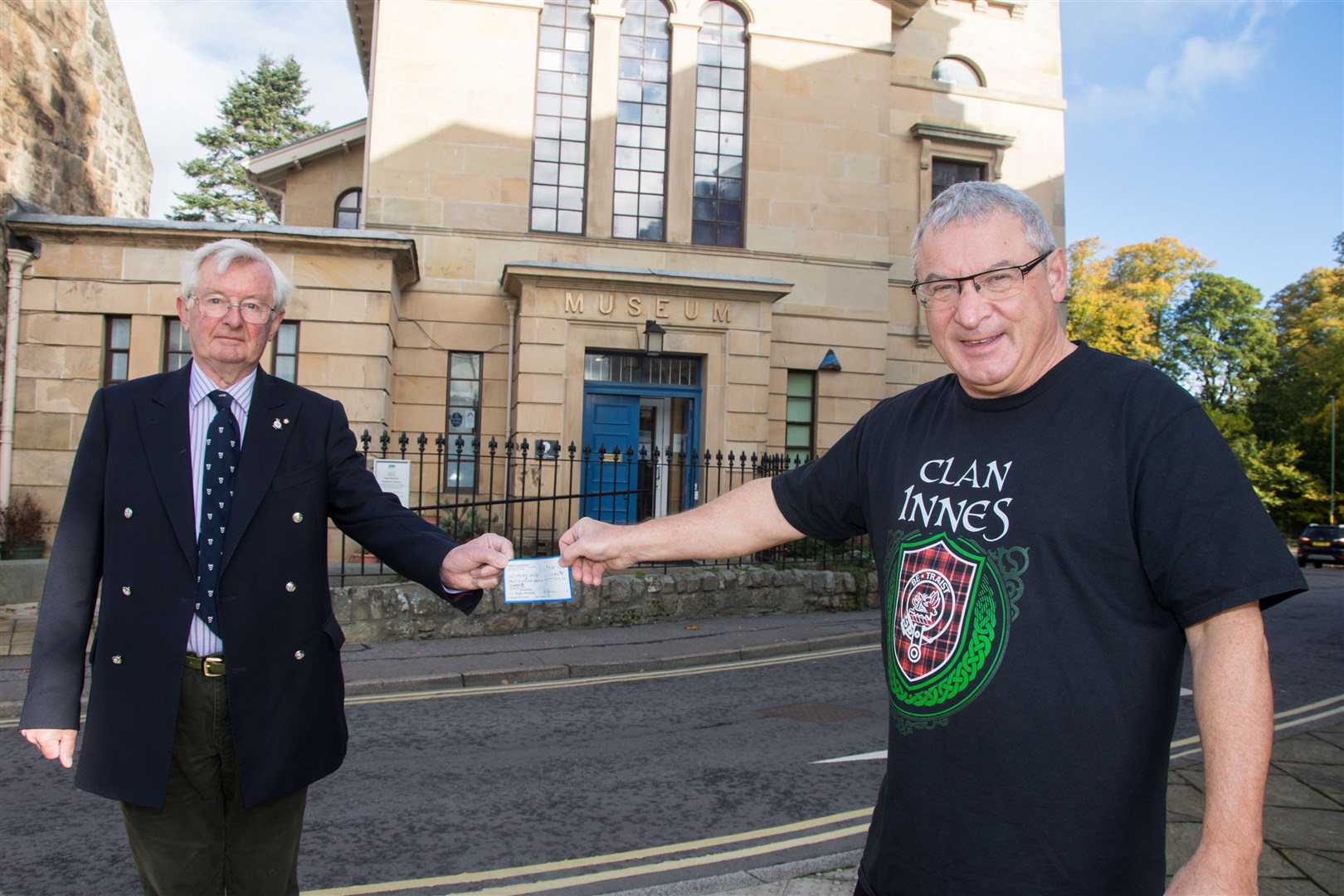 (Left) Grenville Johnston, president of the Moray Society, accepts the donation from Roddy Innes, new Scottish regional commissioner for the Innes Clan Society in Elgin. Picture: Becky Saunderson.