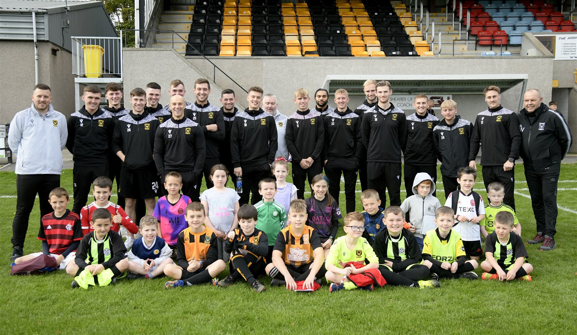 All of the kids alongside the Huntly FC players and staff at Christie Park, Huntly. Picture: Beth Taylor