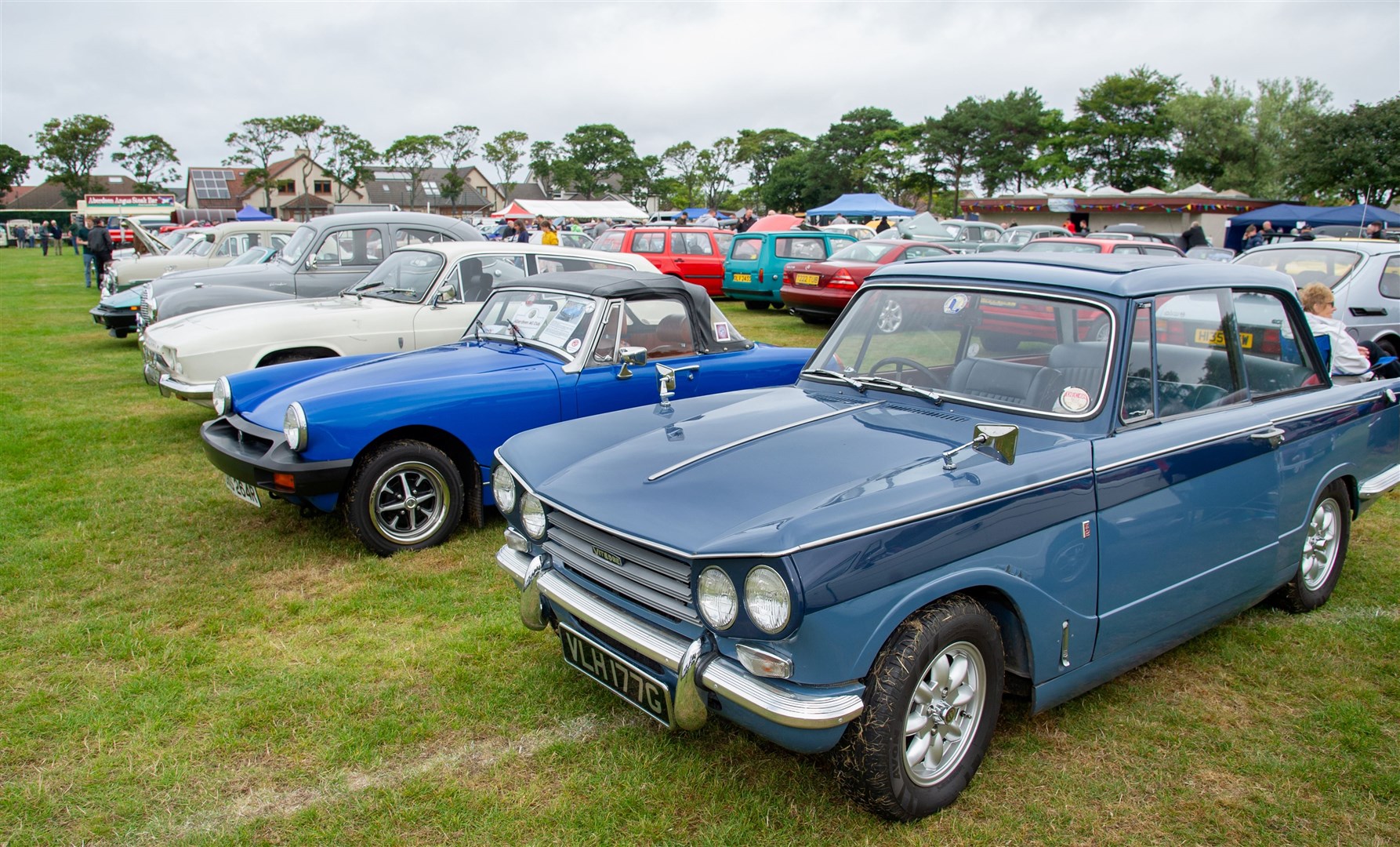 A Triumph Vitesse in a row alongside other classic cars. Picture: Daniel Forsyth