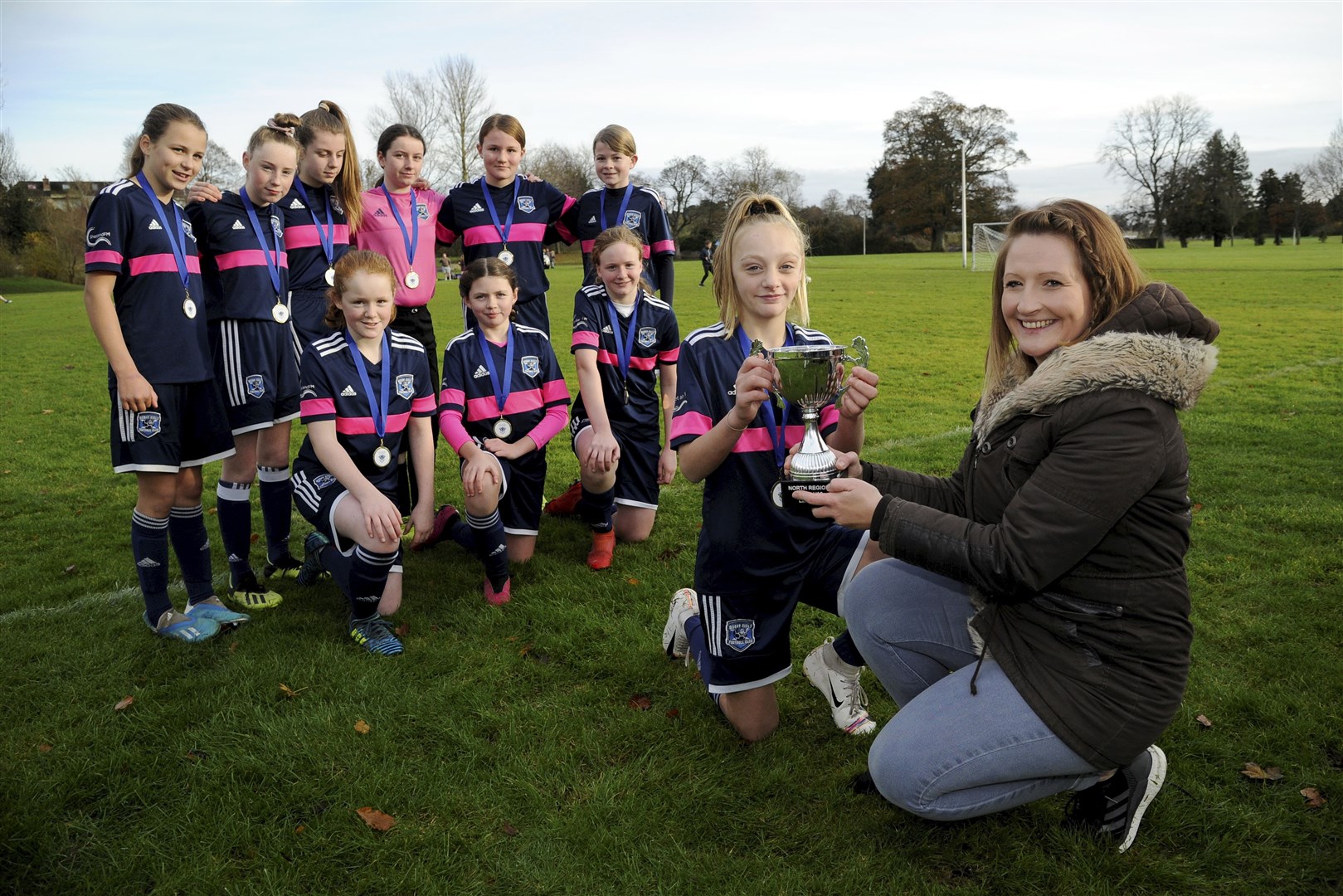 Claire Grieg, SFA North Region administrator, presents Moray Girls with their trophy. Picture: Eric Cormack.
