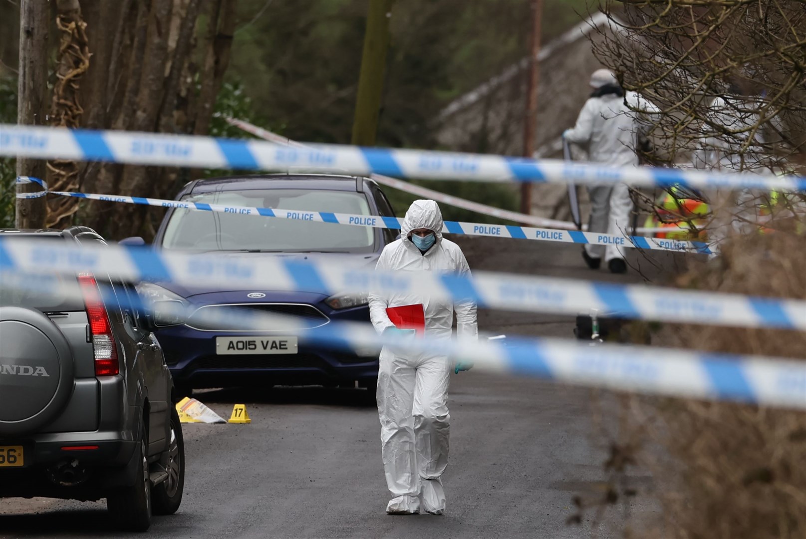 Forensic officers at the sports complex in the Killyclogher Road area of Omagh where off-duty Detective Chief Inspector John Caldwell was shot last February (Liam McBurney/PA)