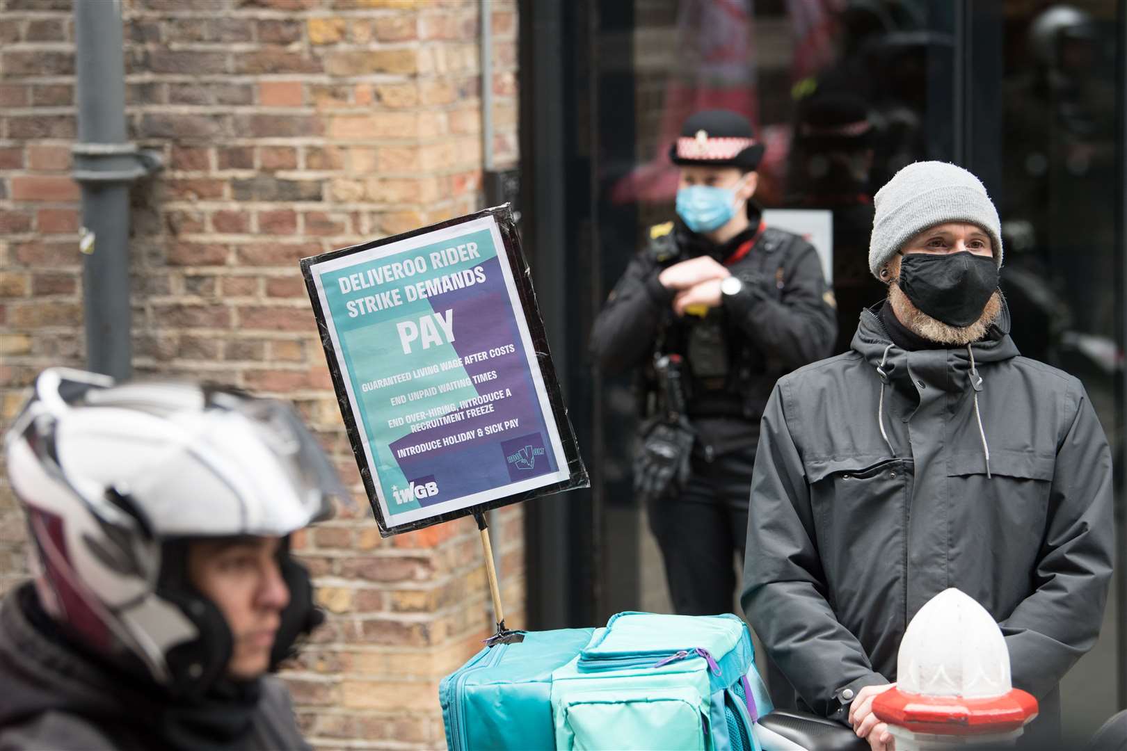 Deliveroo riders protest in a campaign for fair pay, safety protections and basic workers’ rights (Stefan Rousseau/PA)