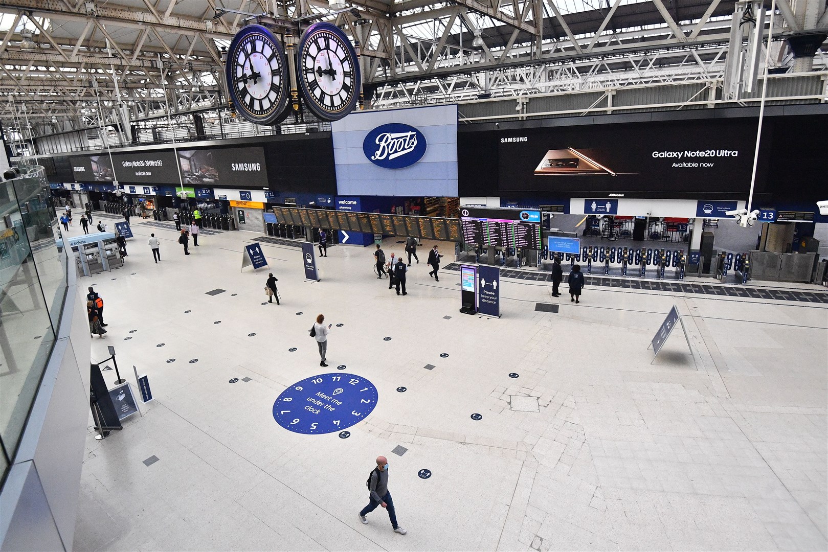 Commuters cross the concourse at Waterloo Station on Friday morning (Victoria Jones/PA)