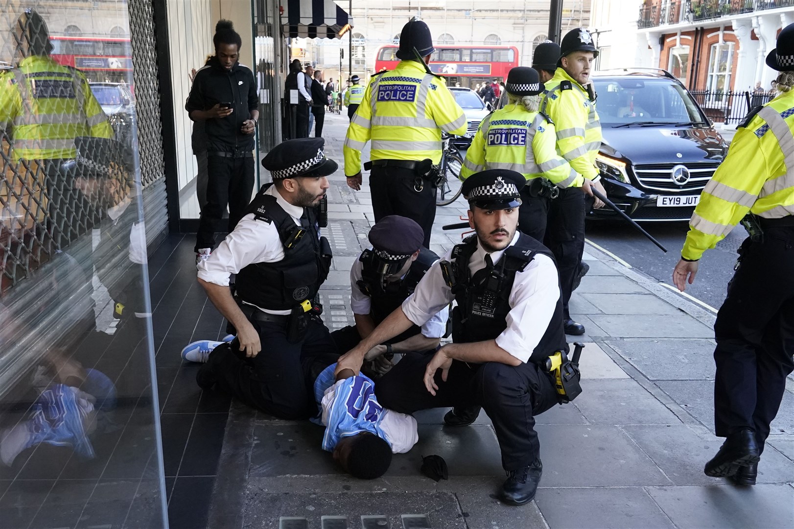 Police were seen wrestling young men to the ground and pulling them away to be handcuffed (Aaron Chown/PA)
