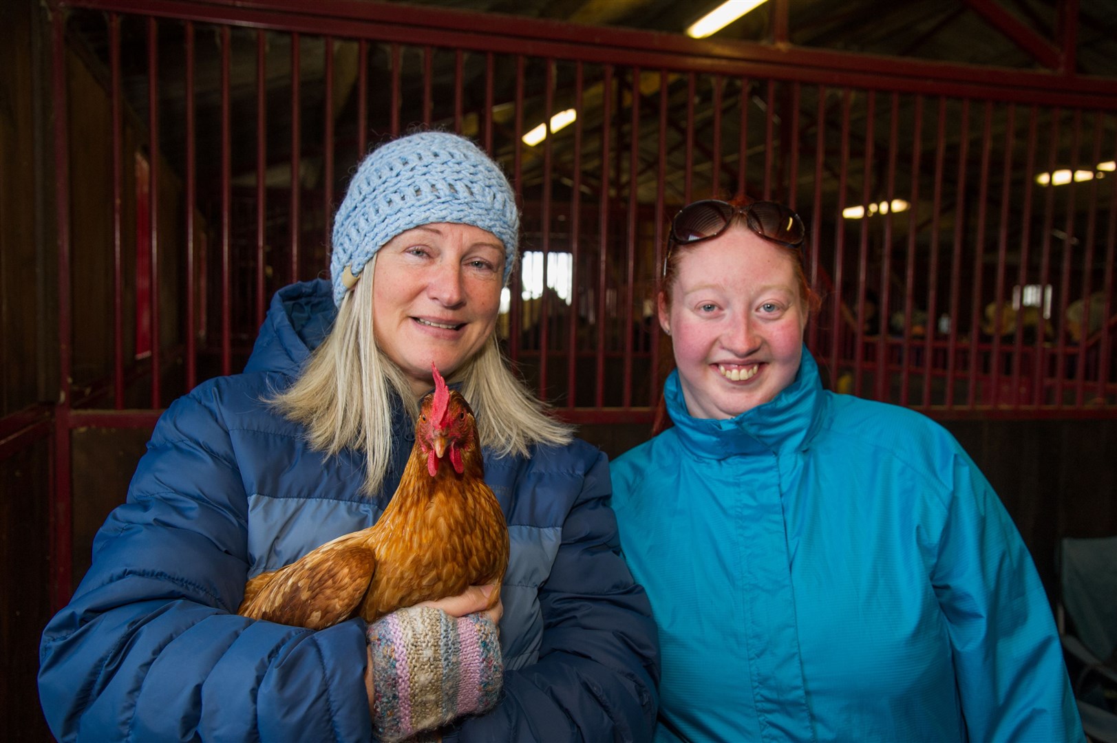 Bridget Cruickshank (left) and Anya Thomas with the therapy hens at Touchdown Memorial Home for Horses. Picture: Becky Saunderson.