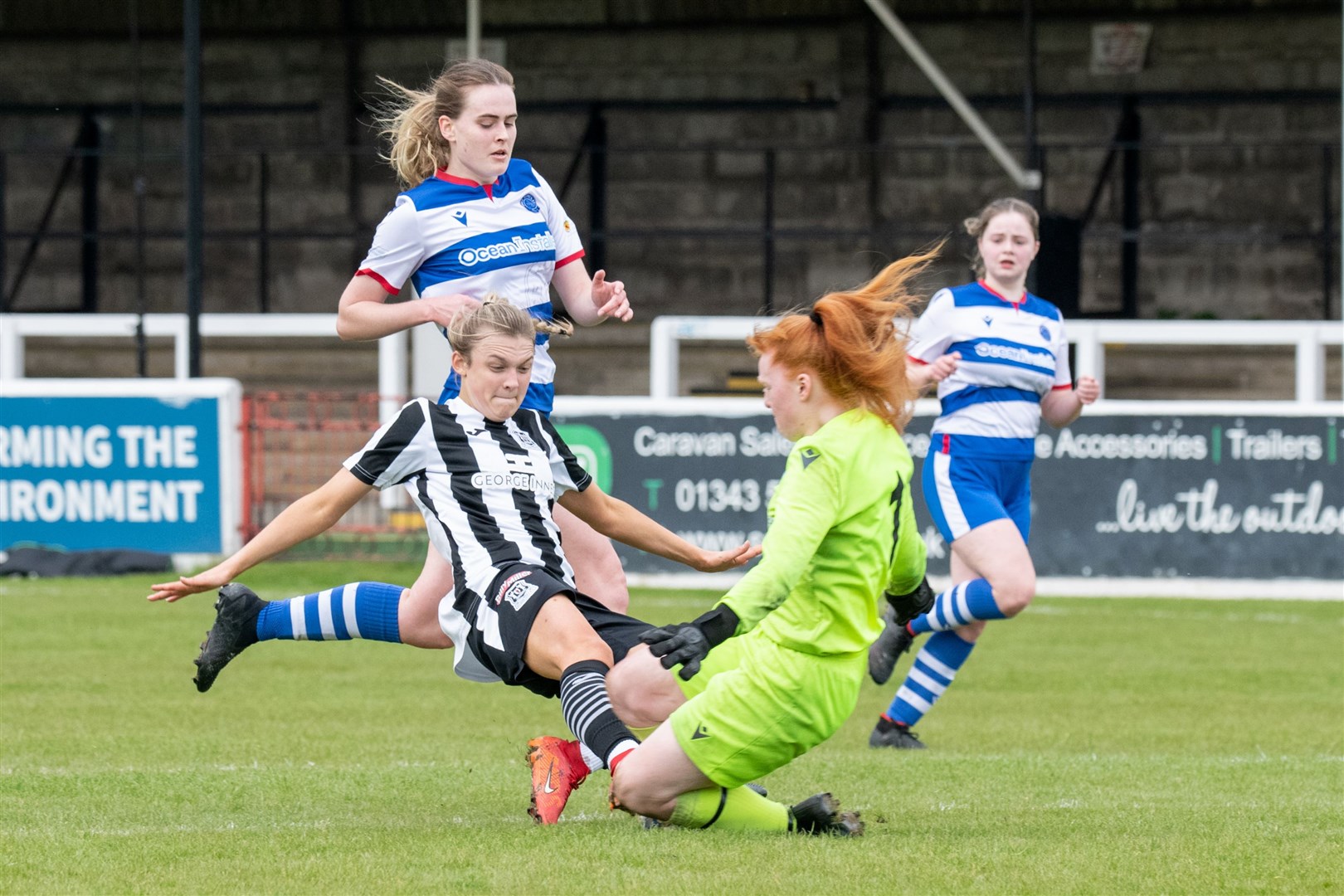 Elgin City's Sarah Westwood clashes with Dyce keeper Faith Jessica Maan as the home side push for the three points.Elgin City Women (5) vs Dyce Women FC (5) - SWFL North 2023/24 - Borough Briggs, Elgin 5/5/2024.Picture: Daniel Forsyth.