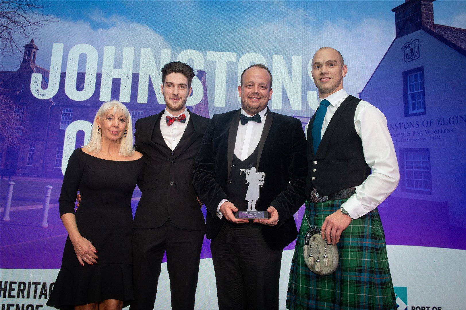 On stage at the Highlands and Islands Tourism Awards are (from left) Geraldine Brebner, Lewis Kinniburgh and Stewart Marshall of Johnstons of Elgin with Stuart MacDonald-Butler of the Port of Cromarty Firth Authority.