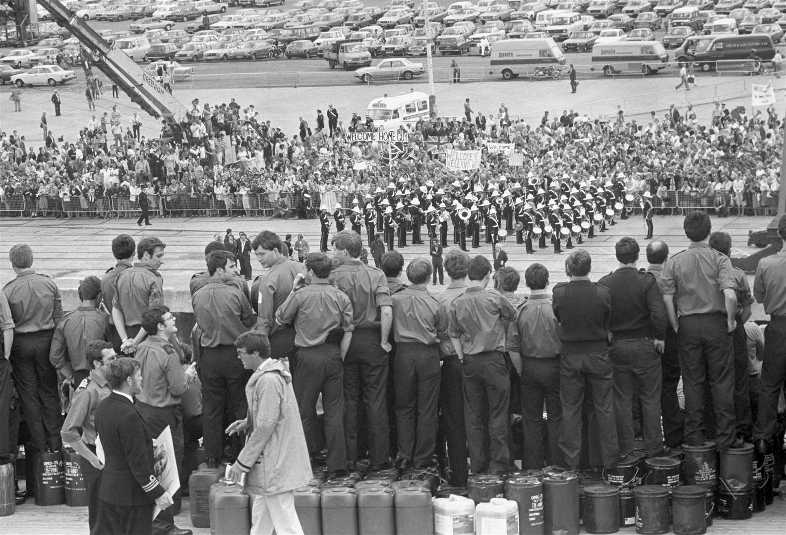 A Royal marines band, family and wellwishers greet survivors of the warships HMS Coventry, Antelope and Ardent as they arrive at Southampton on the QE2 (PA)